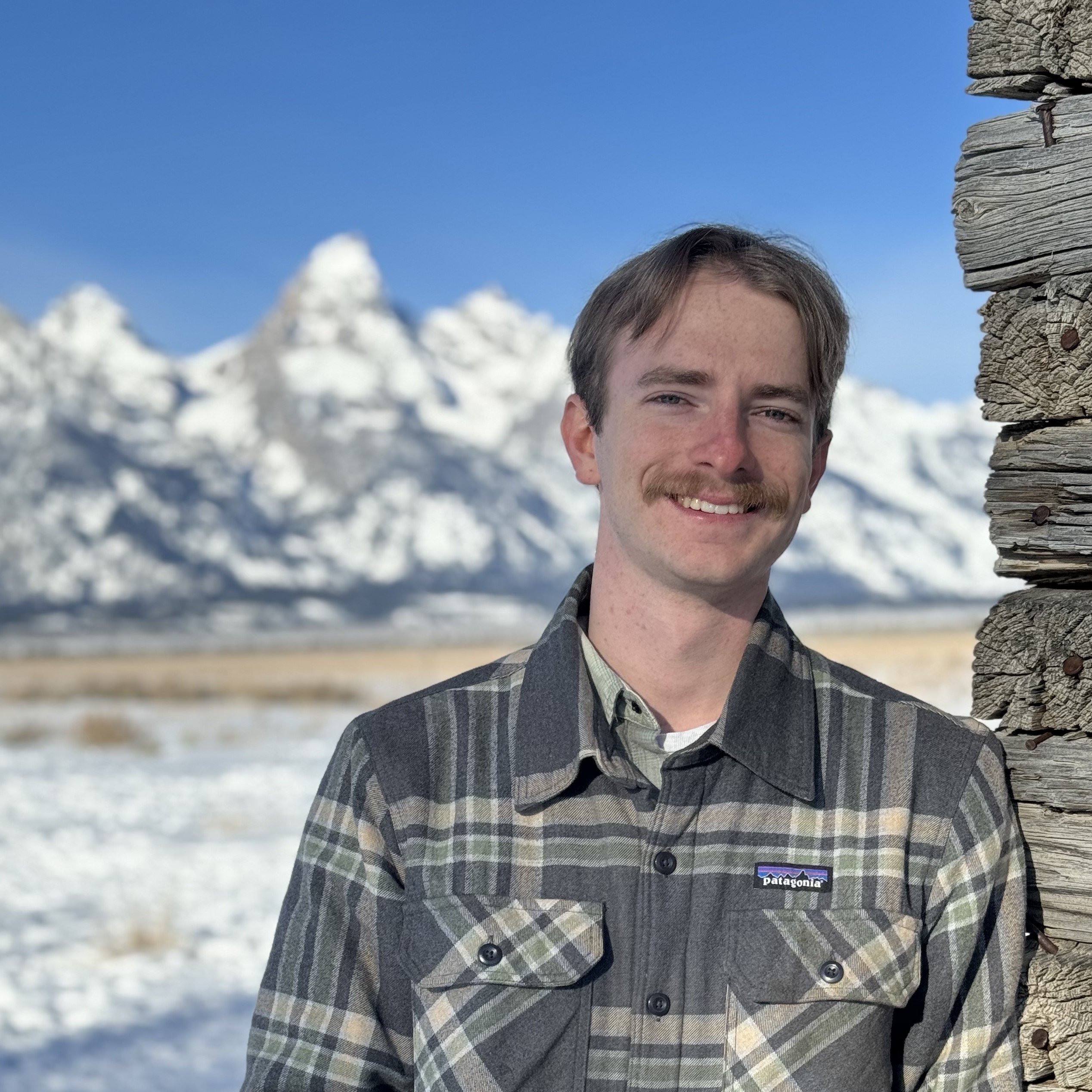 Profile picture of a man in front of mountains